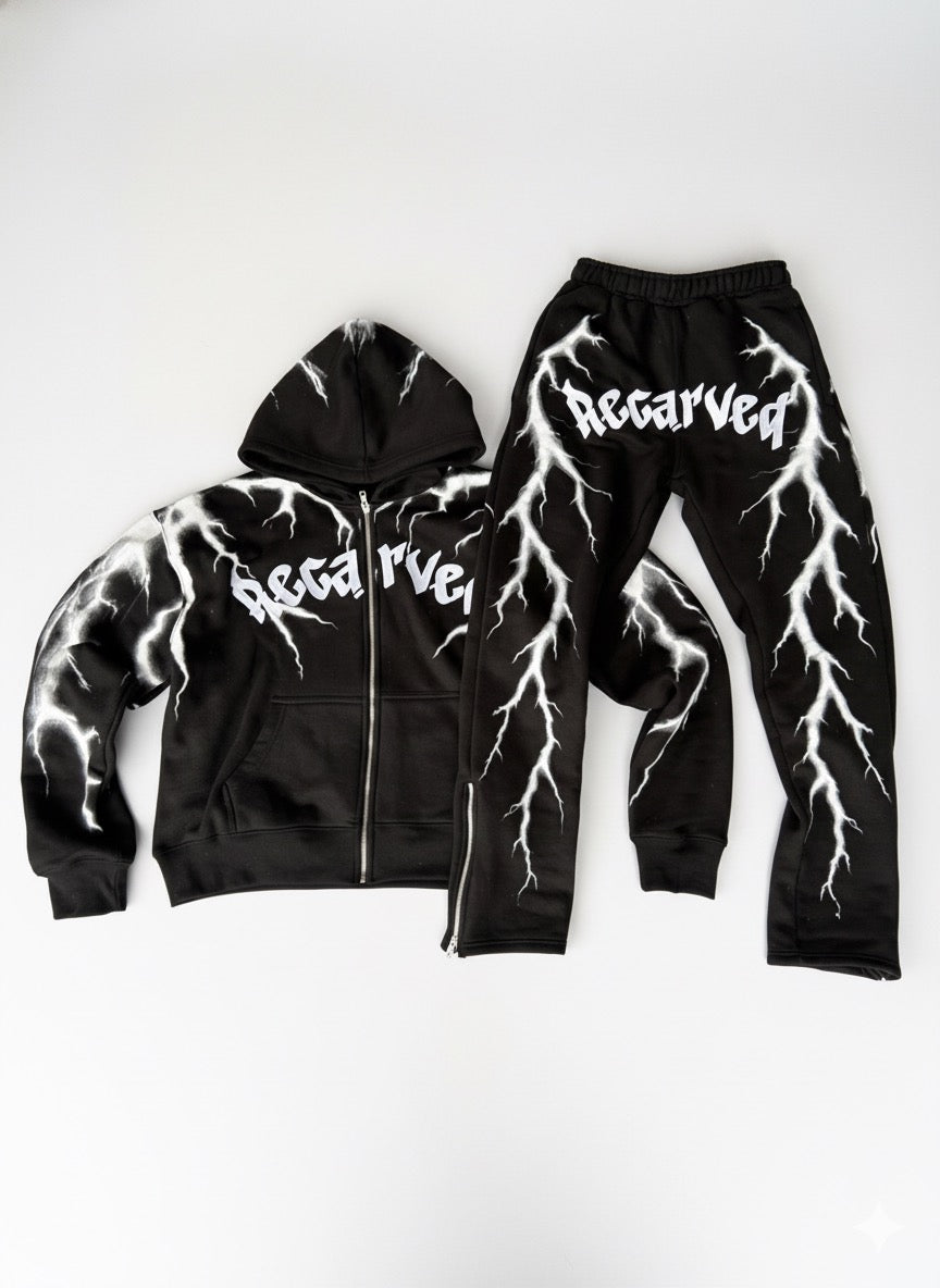 Black hoodie and pants set with white lightning design and 'Recarved' branding on a white background